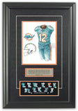 This is an original watercolor painting of the 2018 Miami Dolphins uniform.
